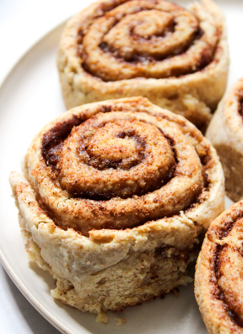 whole wheat cinnamon rolls served on a beige plate